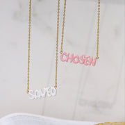 Christian jewelry collection with faith-based necklaces featuring words like blessed, loved, redeemed, and chosen. Minimal gold and enamel pieces designed for Christian women to express their identity in Christ. Inspirational Bible verse jewelry from Ephesians 1 by AMADI Jewelry.