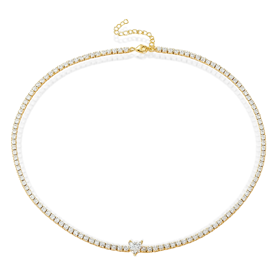 Gold necklace with clear stones on a white background